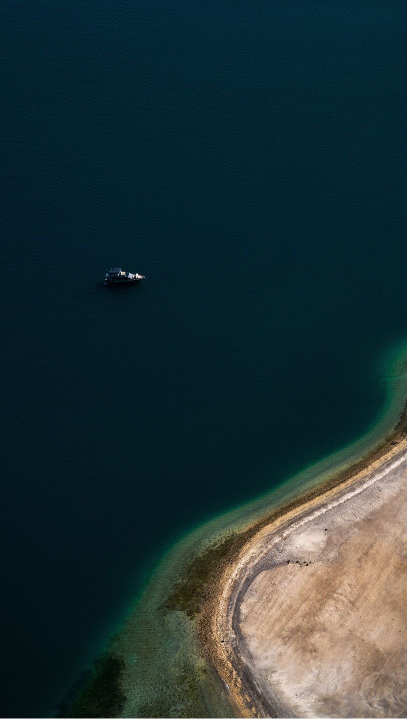 GM
Lonely boat off the distant shores